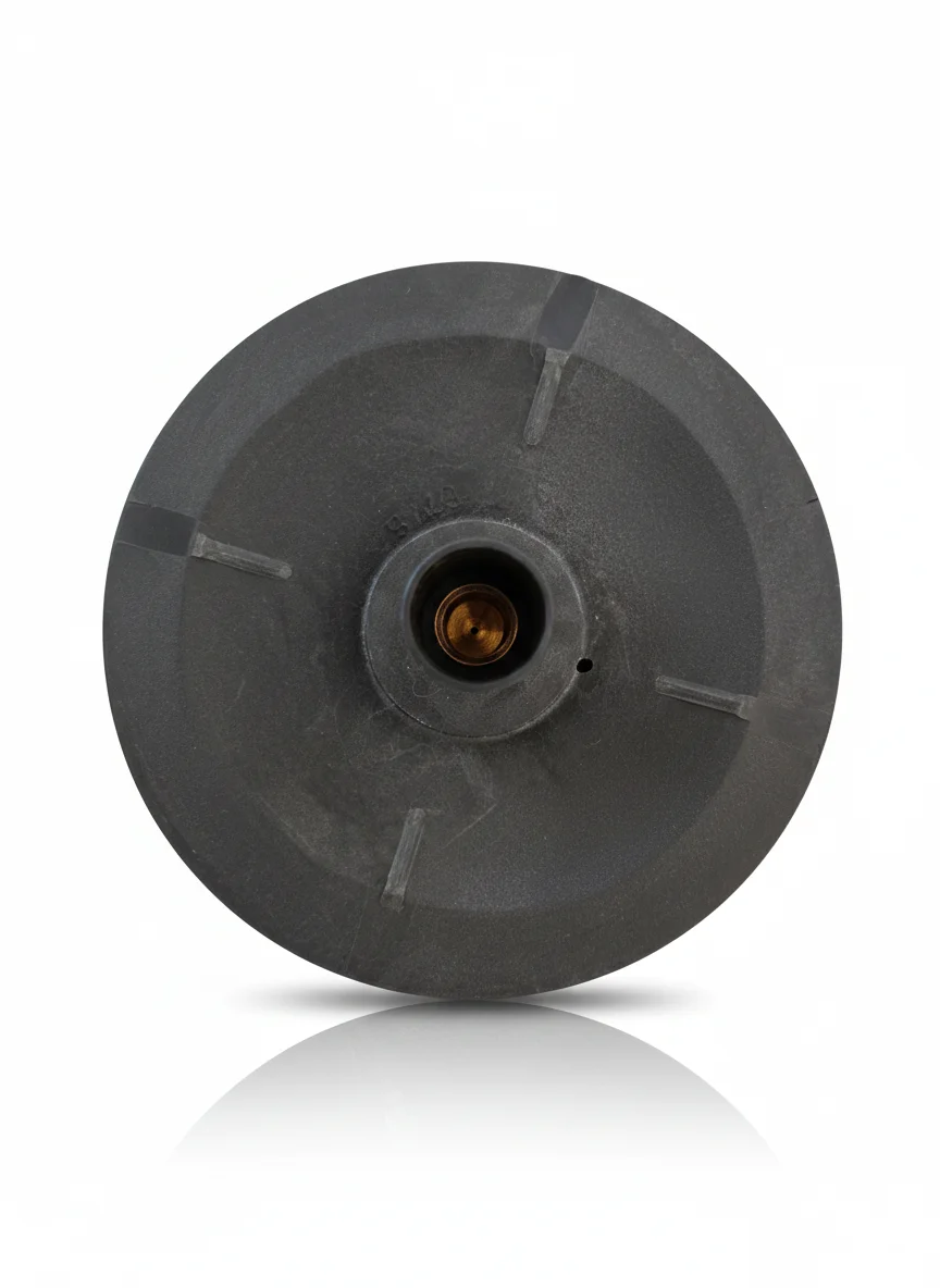 Componente circular de color negro con un orificio central, utilizado en sistemas hidráulicos.