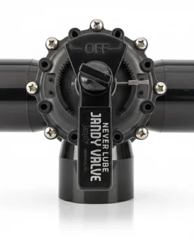 Válvula Jandy Never Lube con cuerpo negro y manija de control en posición de apagado.